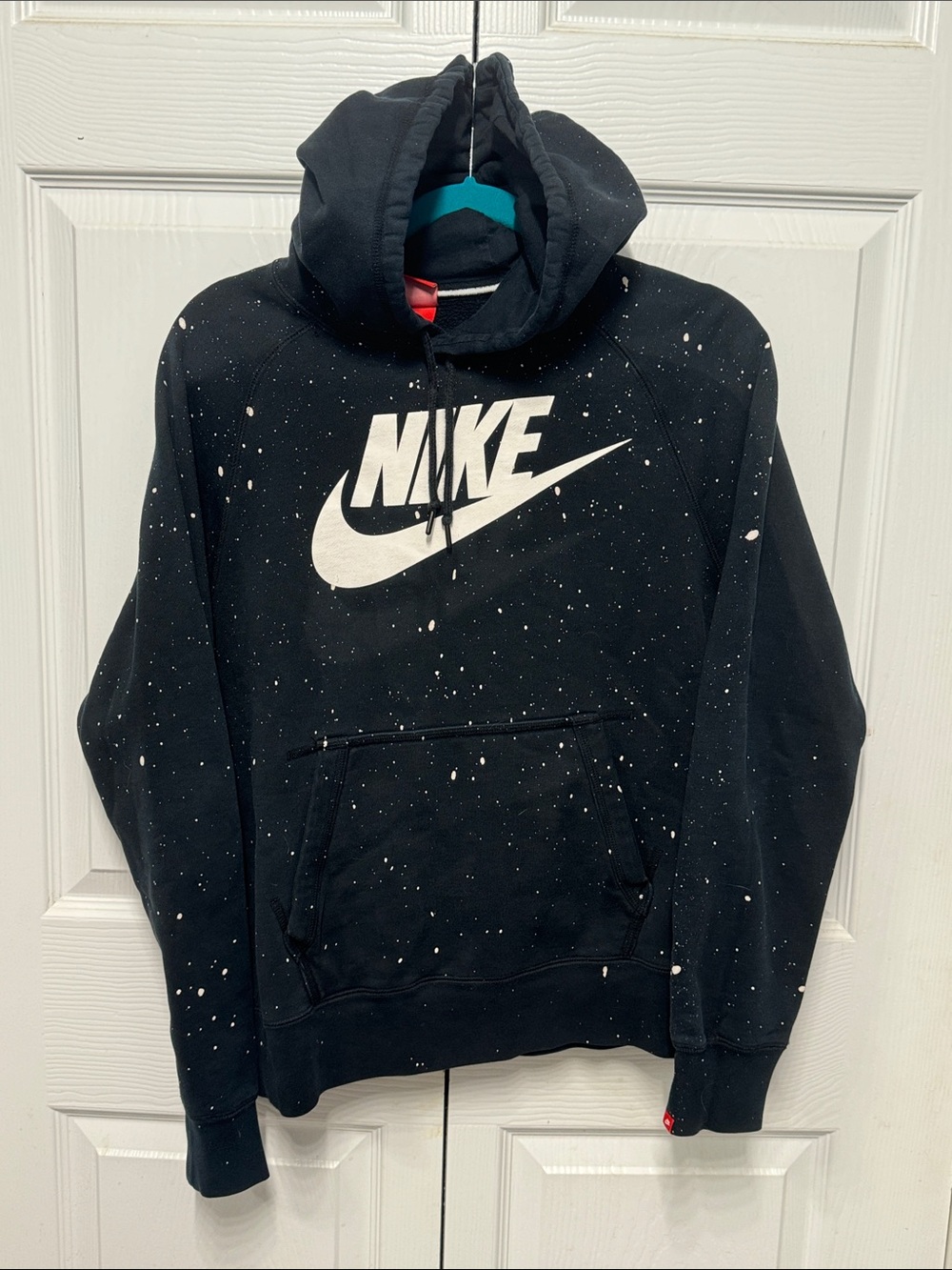 Nike Black Pullover Hoodie with White Swoosh and Paint Speckle